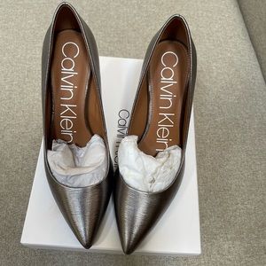 Brand new Calvin Klein silver pumps size 7M.